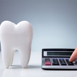 Tooth next to a calculator