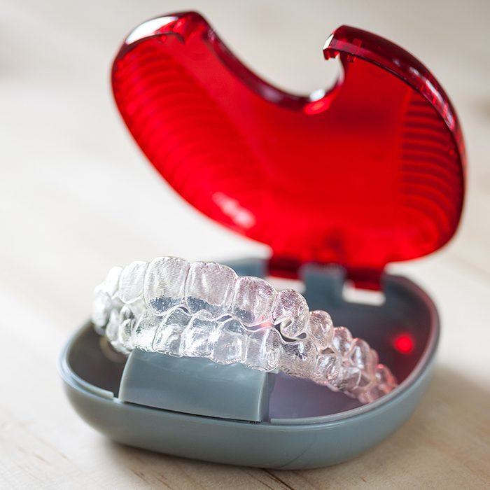 Set of Invisalign trays in carrying case