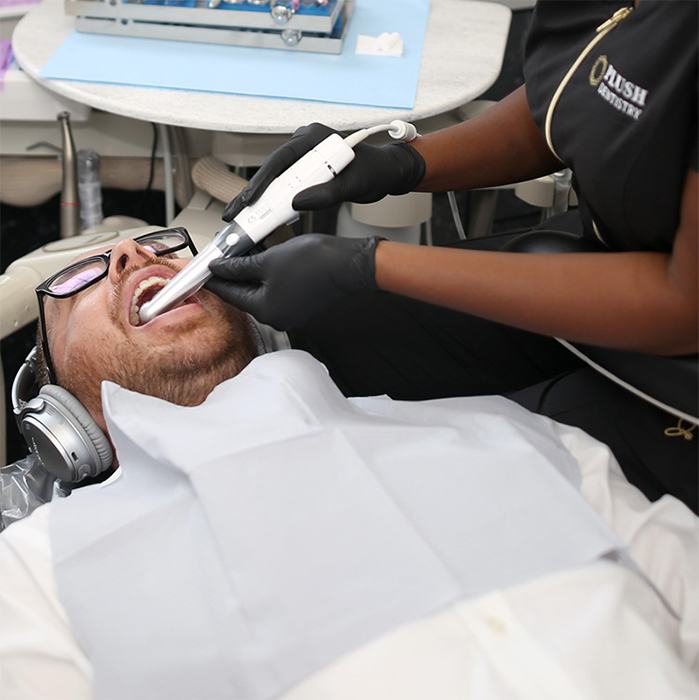Dental team member using a C S 1500 intraoral camera